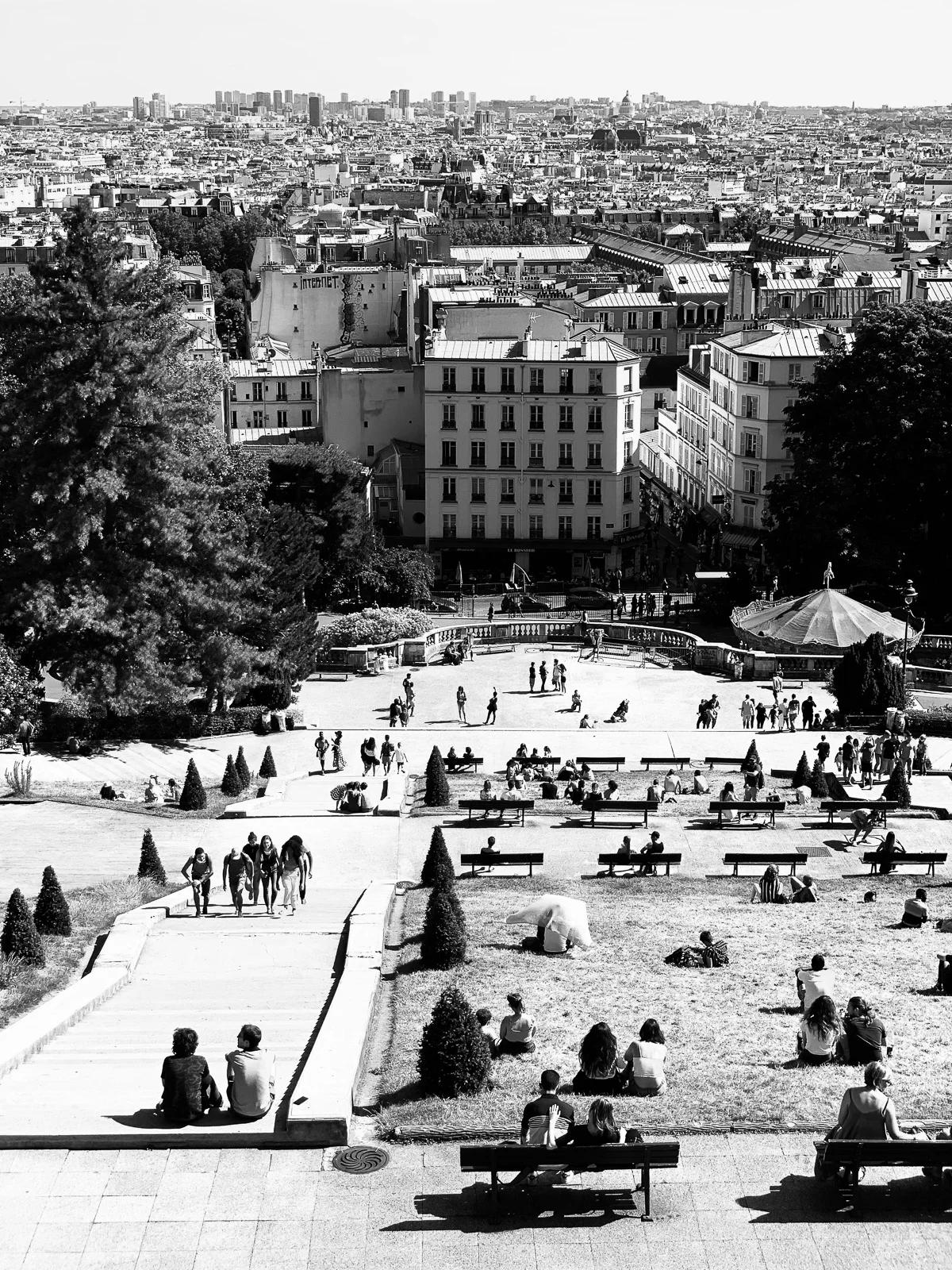 People gathering on a wide city stairway. Photograph by Adelina Persa.