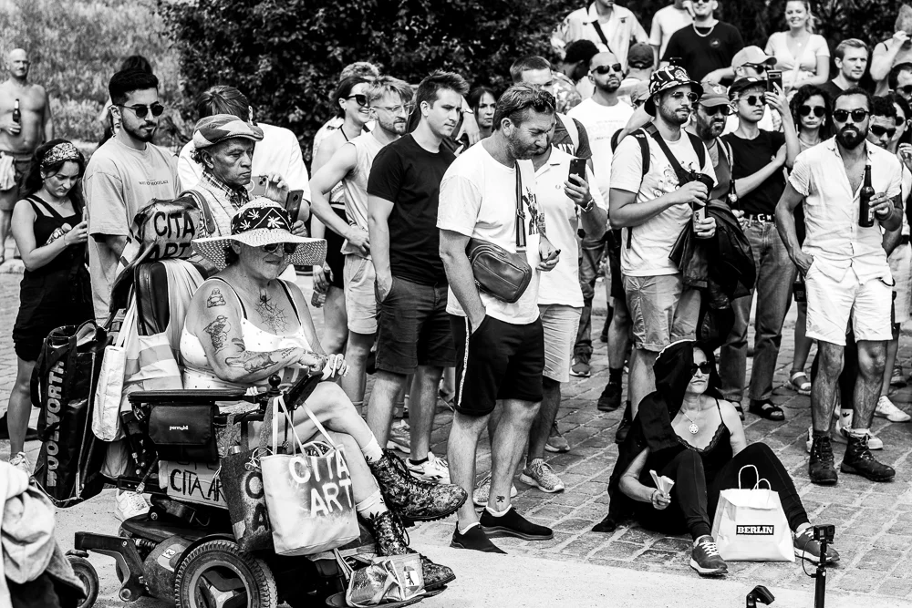 A group of people listening to outdoor music. Photograph by Adelina Persa.